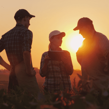 Our History Three People Standing in Field